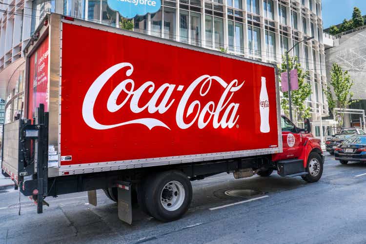 Coca Cola truck driving on a street