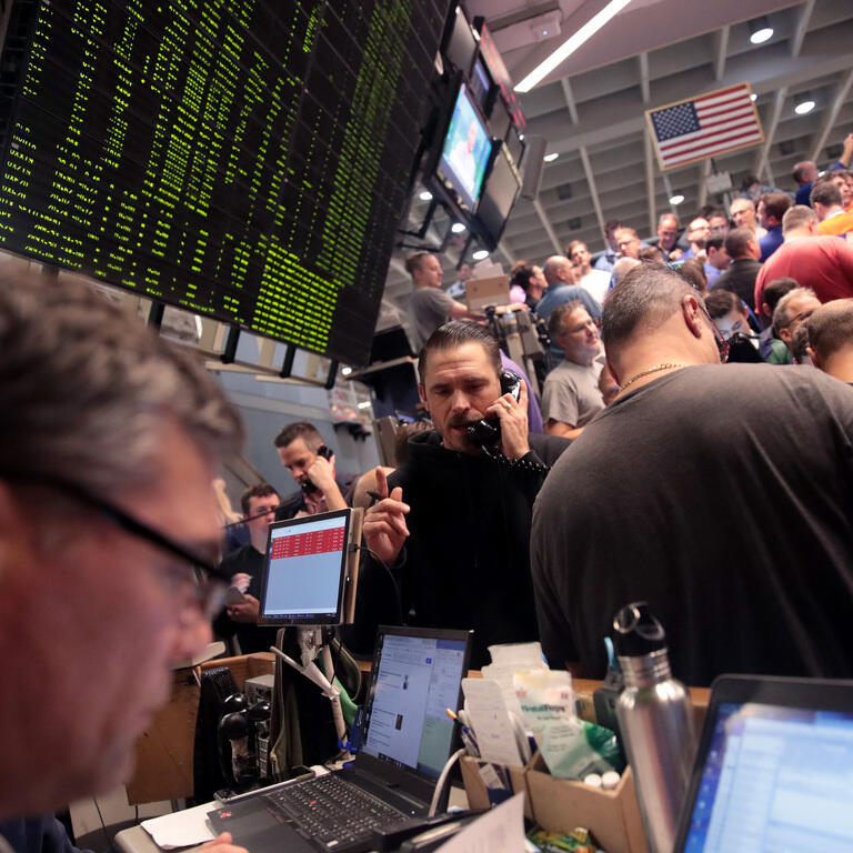 Traders Work On The Floor Of The CBOE Global Markets