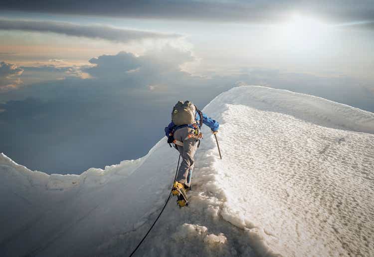 Climber on a snowy ridge
