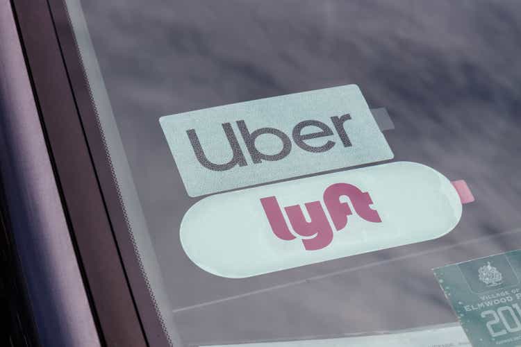 Uber and Lyft stickers displayed. Lyft and Uber ride sharing has replaced many Taxi cabs for transportation III
