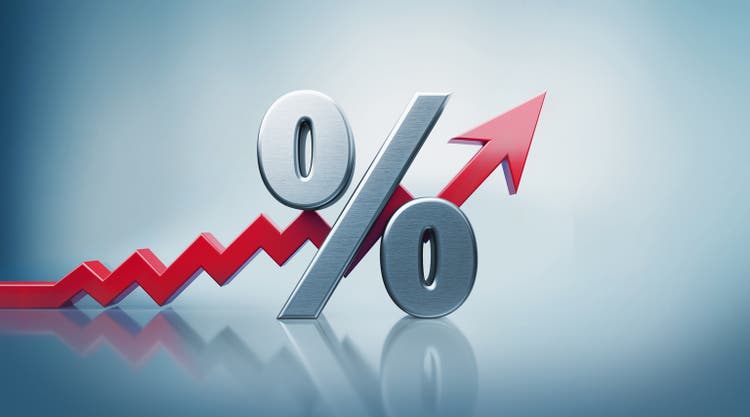 Percentage Sign with Red Arrow Moving Up on Defocused Background