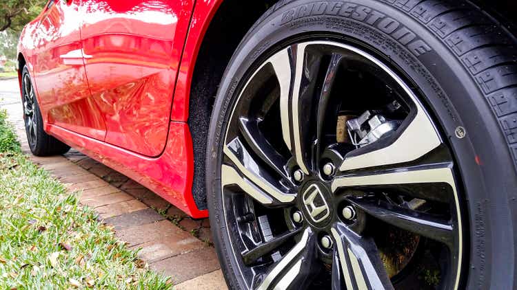 Close-up of the rear wheel of a 10th generation Honda Civic from a low angle