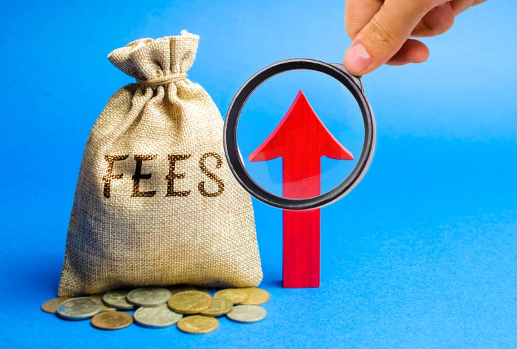 Money bag with the word Fees and up arrow. Duty increase concept. Trade wars. Import and export quotas. High taxation. Free trading zone. Business and Finance