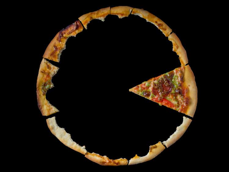 close up of eaten pizza parts on the black background