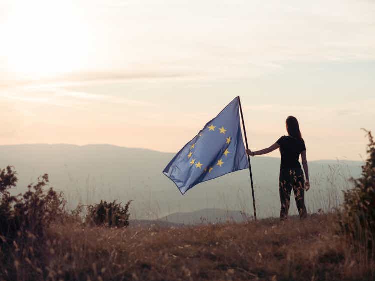 Woman holding European Union flag