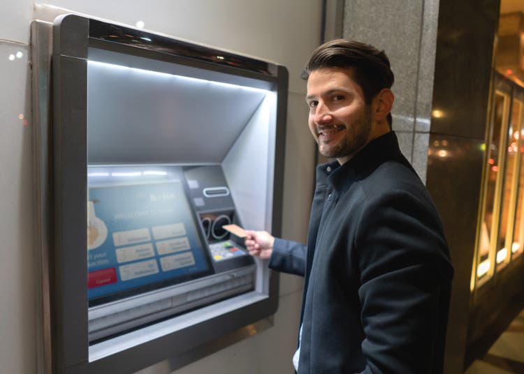 Man withdrawing money at a cash point