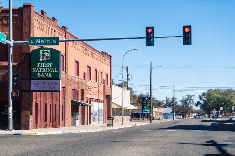 Small town in Colorado with red light on main street downtown and first national bank