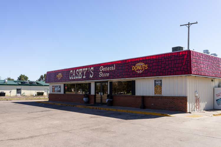 Small town in Kansas with exterior of building for Casey"s General Store and sign