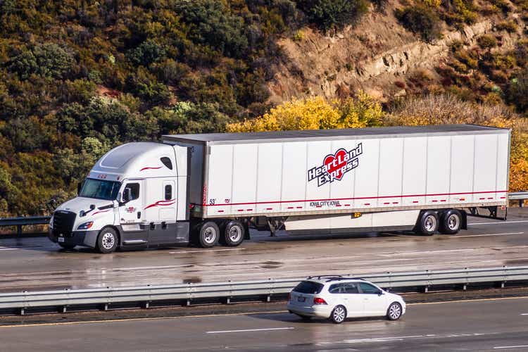 Heartland Express truck driving on the freeway