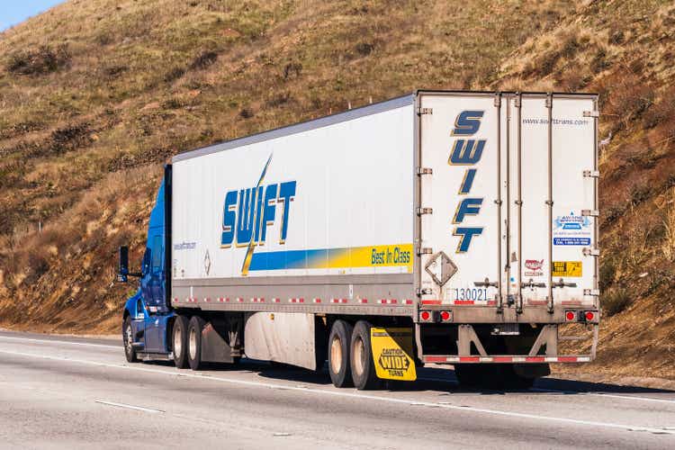 Swift truck driving on the freeway