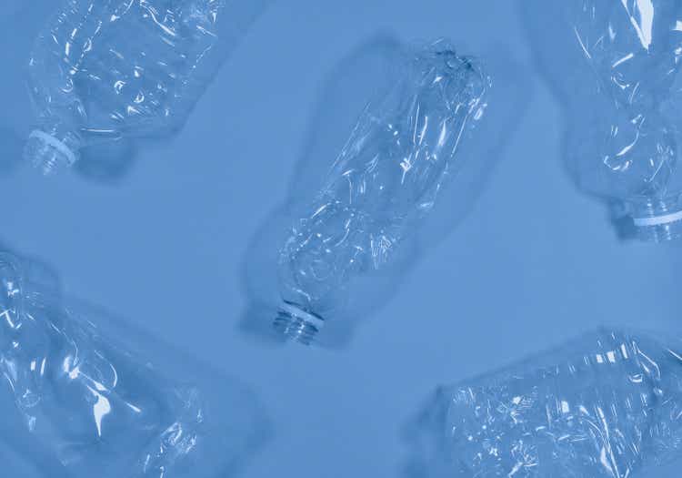 Plastic bottles isolated on deep blue background.