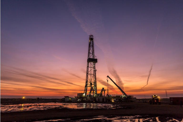 Fracking oil rig at dawn