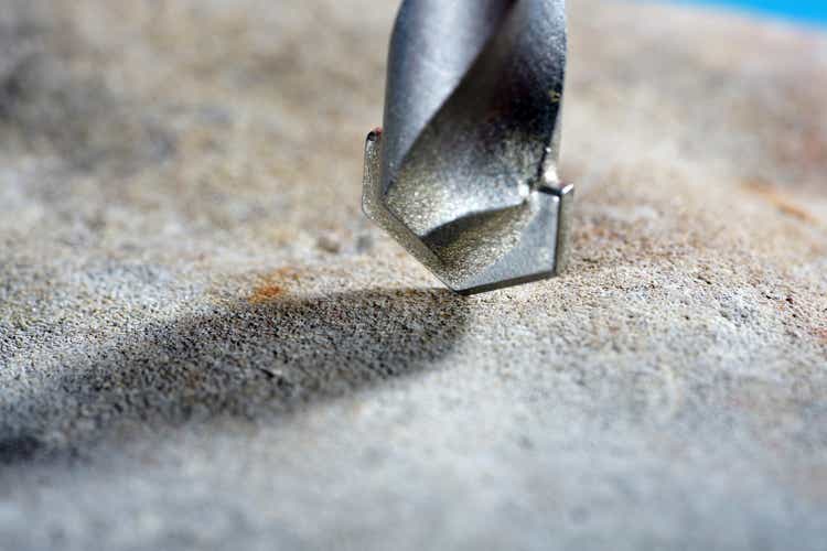 Stone drill bit with drill bit in natural stone and concrete photographed in the studio