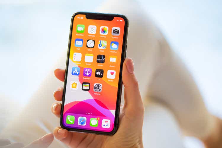 Woman using Apple iPhone 11 Pro smartphone