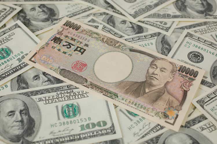Japanese 10000 yen and 100 Dollar bills