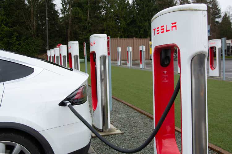 Tesla charging at supercharger station