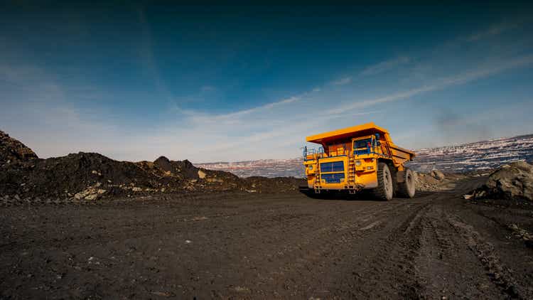 truck in an iron ore quarry transports raw materials