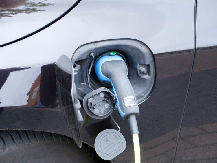 Electric car vehicle in Allego charging stock photo