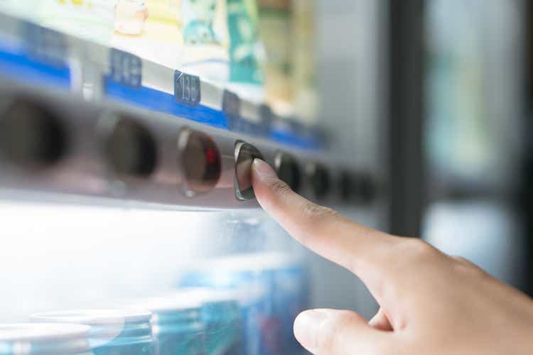 Finger press button on the vending machine