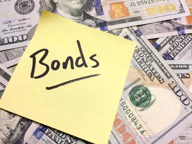 American cash money and yellow post it note with text Bonds