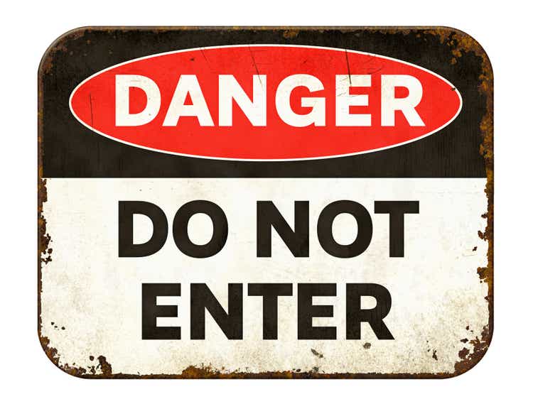 Vintage tin danger sign on a white background - Do not enter