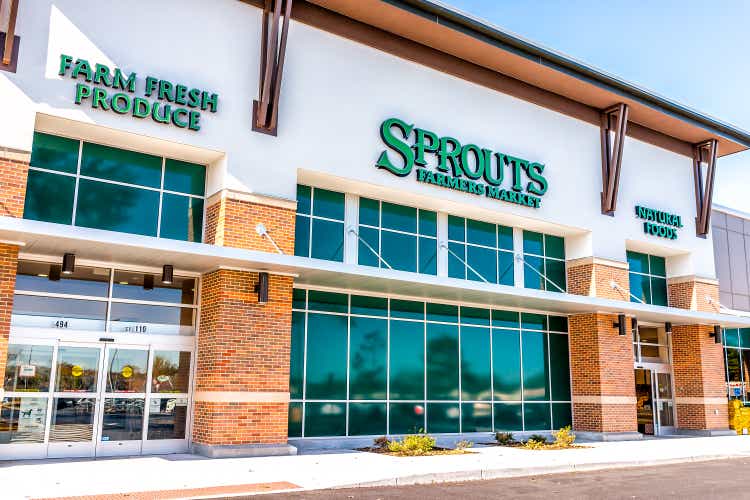 Exterior of Sprouts Farmers Market store with farm fresh produce sign on street