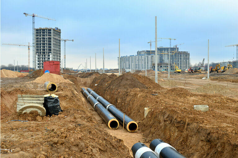 Laying underground storm sewers at a construction site
