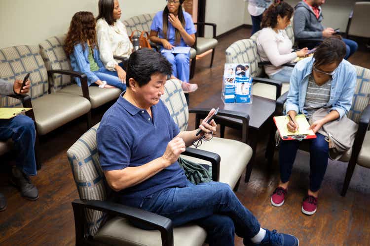 Asian senior man waits for doctor appointment