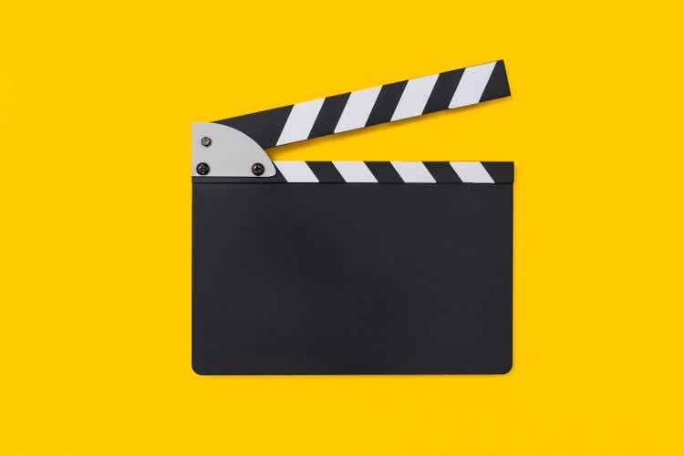Movie clapper board on yellow background