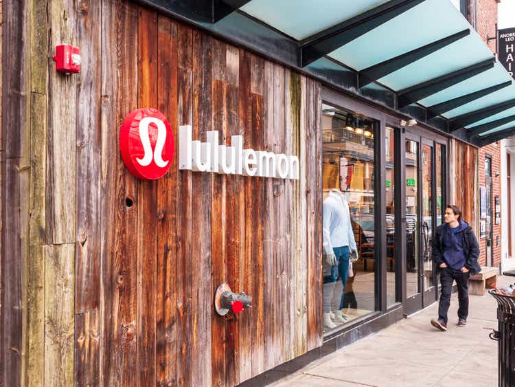 The Lululemon store on Walnut street in the Shadyside neighborhood with a man walking in front of it, Pittsburgh, Pennsylvania, USA