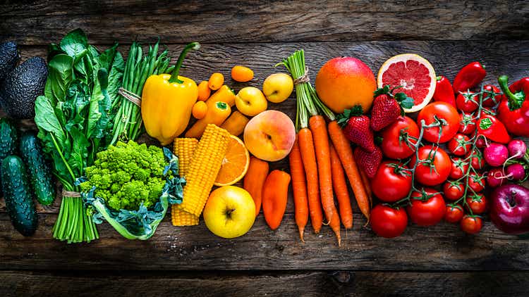 Healthy fresh rainbow colored fruits and vegetables in a row