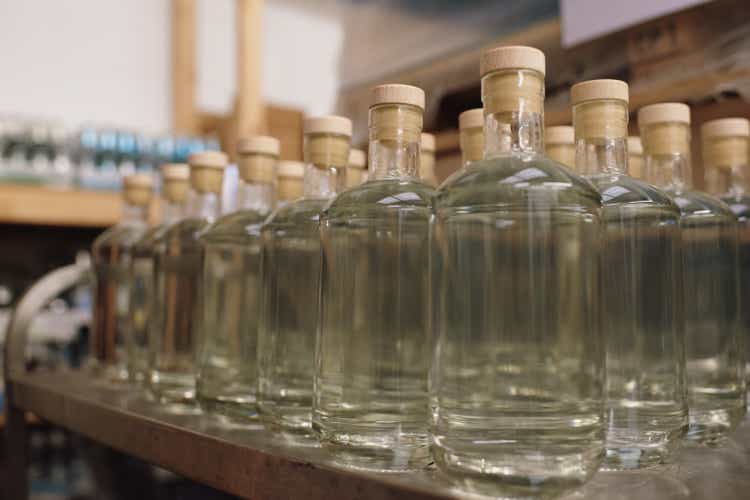 Gin bottles with stoppers in production