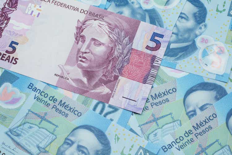 A real note from Brazil with Mexican twenty peso bank notes