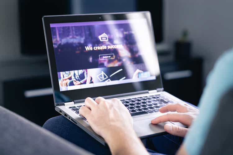 Website graphic design. Web designer, developer or programmer working on a responsive www site interface, UI and UX. Online marketing. Homepage of a startup business webpage.