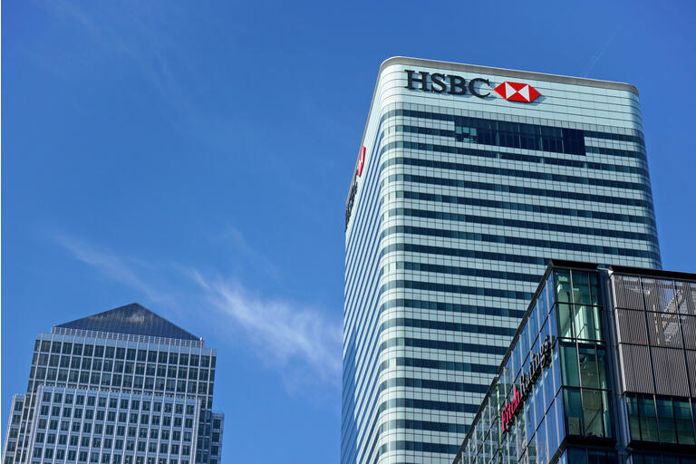 Sun shines on world Headquarters of HSBC Holdings plc at 8 Canada Square, Canary Wharf. It"s 7th largest bank worldwide and was established in 1865