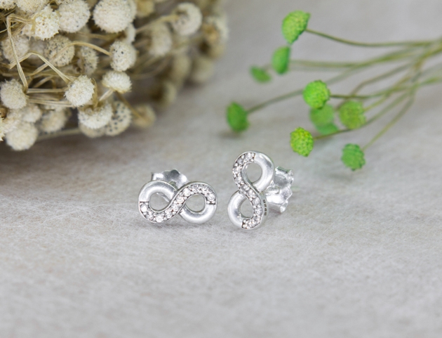 A pair of beautiful diamond earrings in the infinity shape
