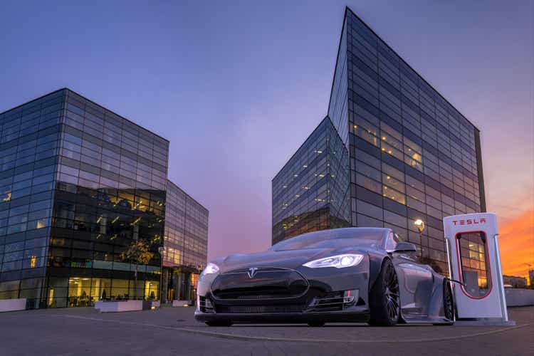 Vision of tuned, sporty Tesla S at the charging point