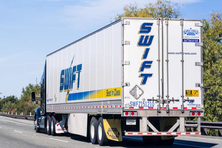 Swift truck driving on the freeway