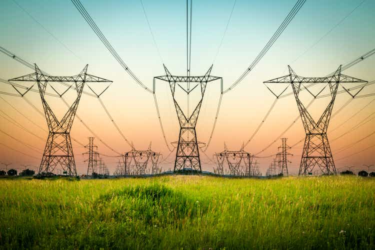 Power lines and landscape at sunset