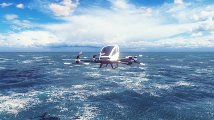 An unmanned passenger air taxi flies over the sea. The concept of the future driverless taxi. 3D Rendering