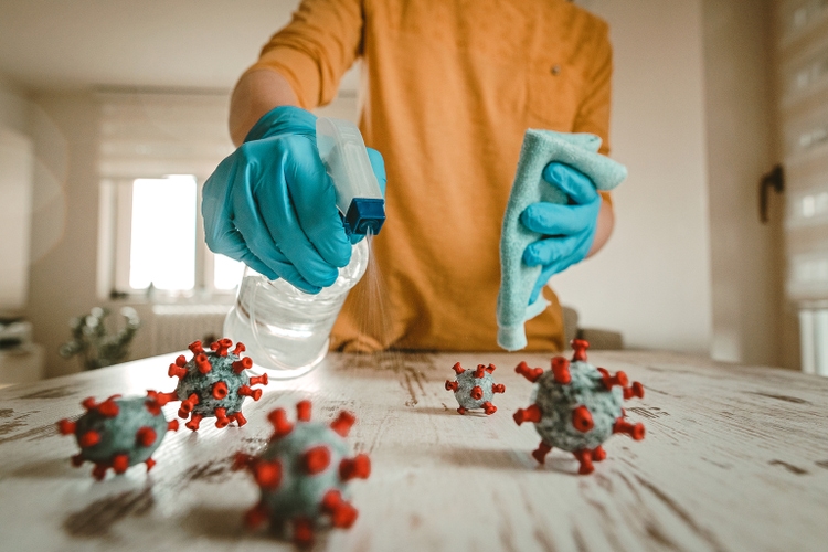 Woman cleaning desk