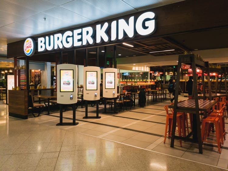 An empty Burger King restaurant inside the departure hall of Athens International Airport Eleftherios Venizelos. Burger King is an American multinational chain of hamburger fast food restaurants