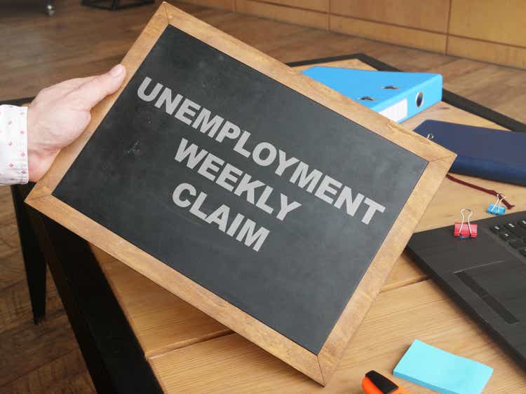 Business photo shows hand written text unemployment weekly claim