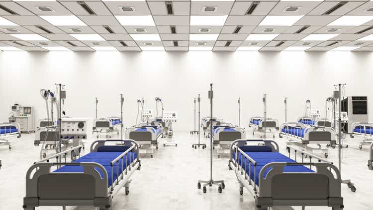 Large Coronavirus Pandemic Hospital Ward with Empty Beds in Large Warehouse