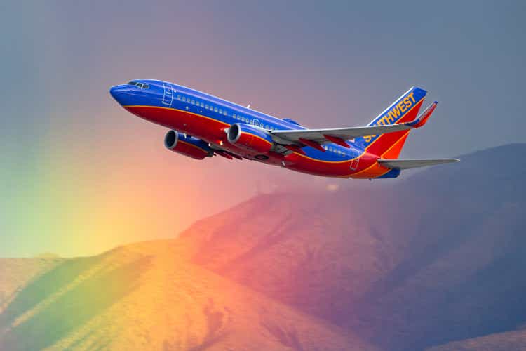 Southwest Airlines Boeing 737 airliner flying past a rainbow as it departs McCarran International Airport in Las Vegas.