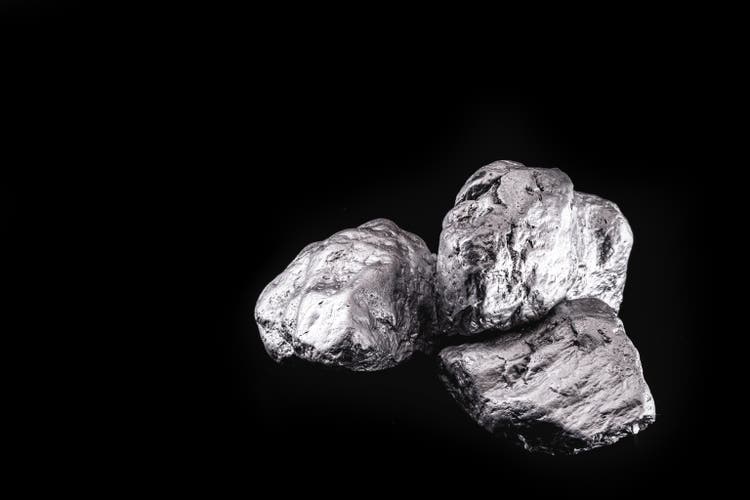 Palladium is a chemical element that at room temperature contracts in the solid state. Metal used in industry. Mineral extraction concept.