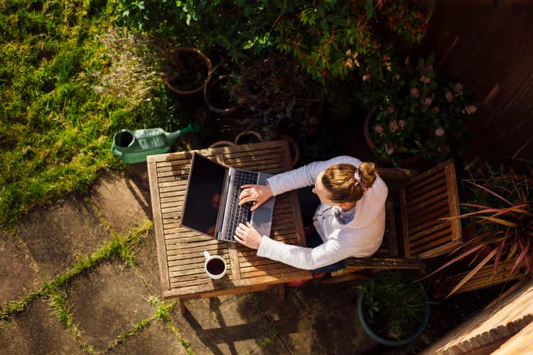 Woman working from home in her garden