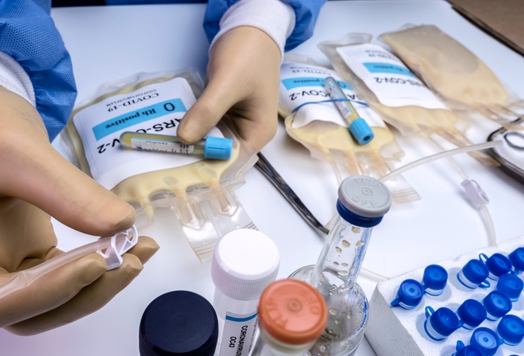 Plasma bag with antibodies from people cured of SARS-COV-2 Covid-19 prepared in a hospital, conceptual image