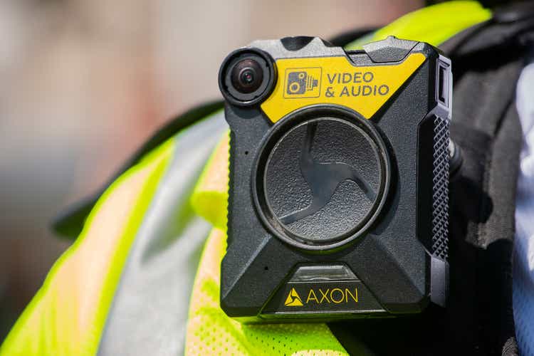 Body camera being worn by police officers in London, to keep officers safe, enabling situation awareness, improving community relations and providing evidence for trials.