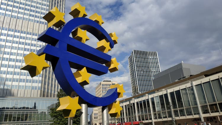 Euro sign at European Central Bank headquarters in the evening, business district in Frankfurt am Main, Germany.